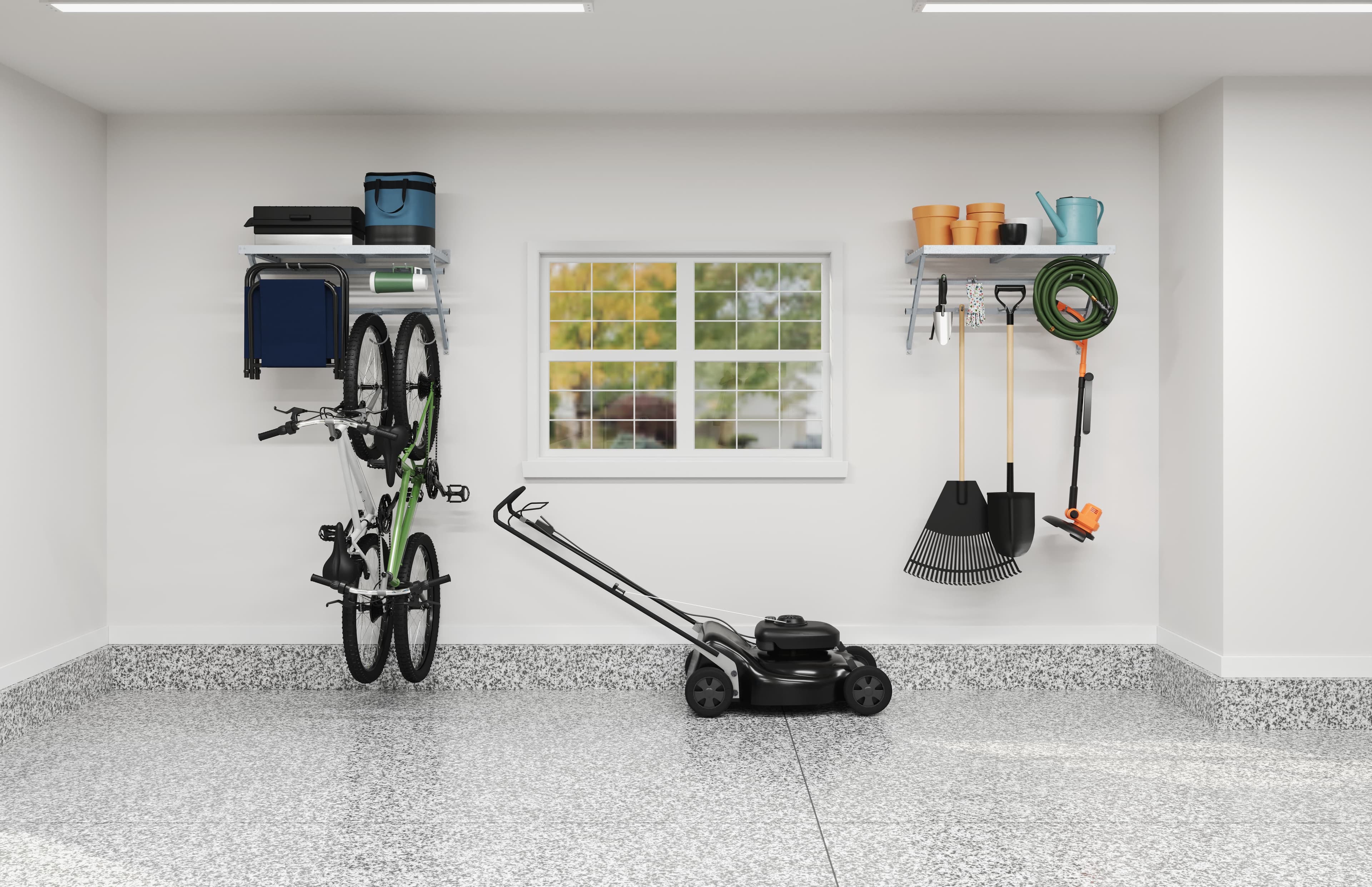 Garage wall with a hanging bike, shelves, and garden tools