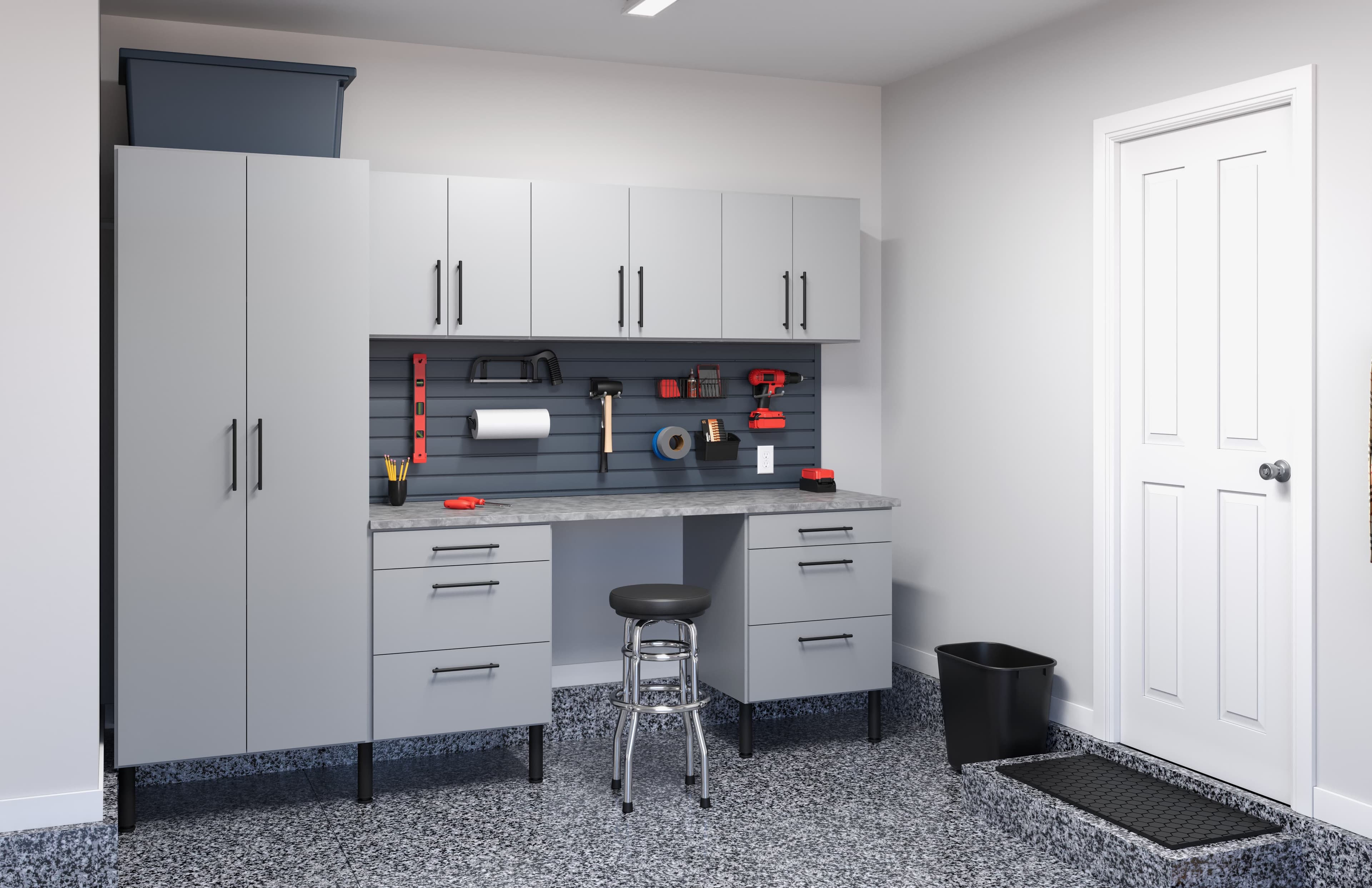 Front view of a garage workbench with drawers and overhead cabinets