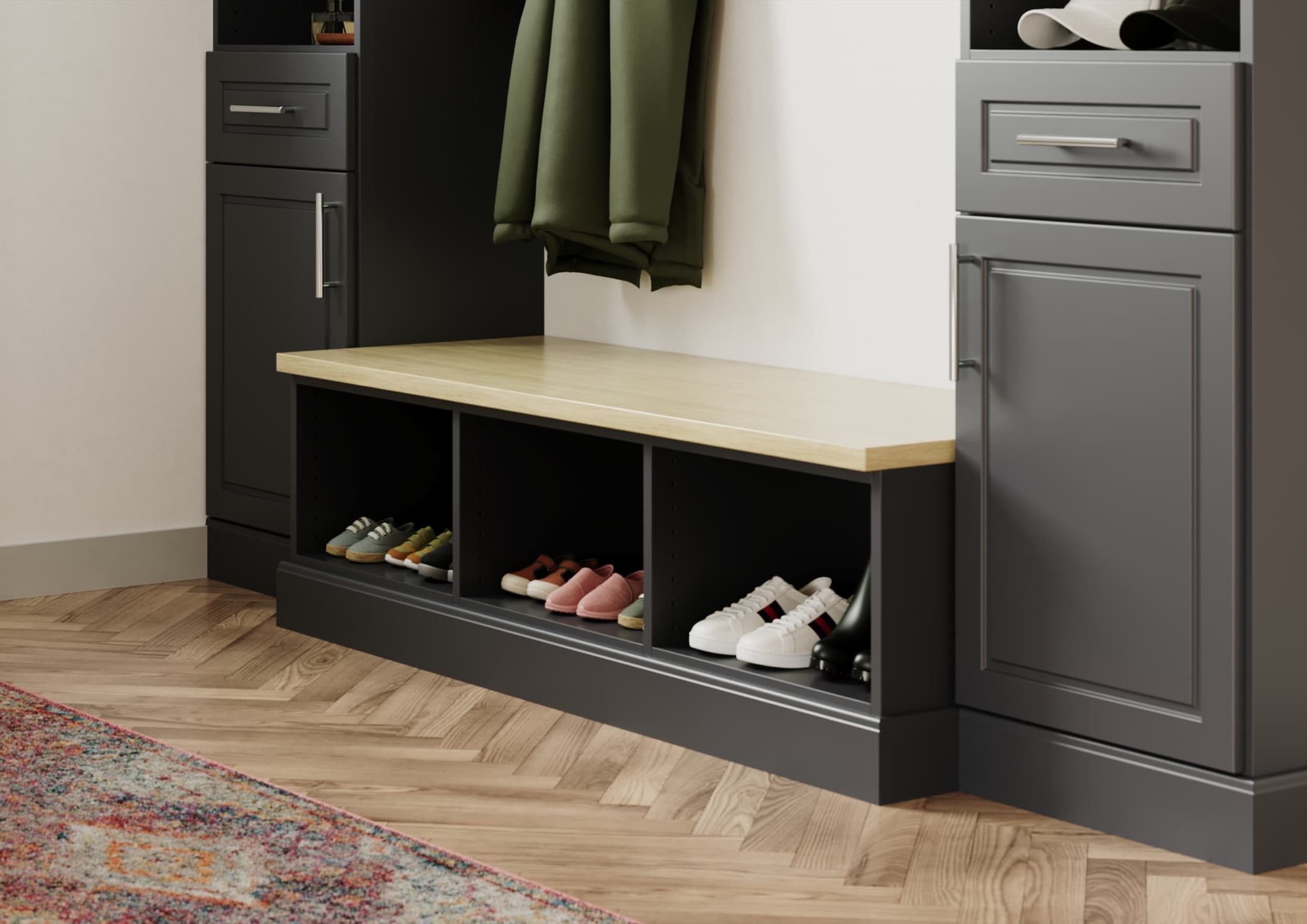 White custom mudroom with bench, hooks, and cabinet storage